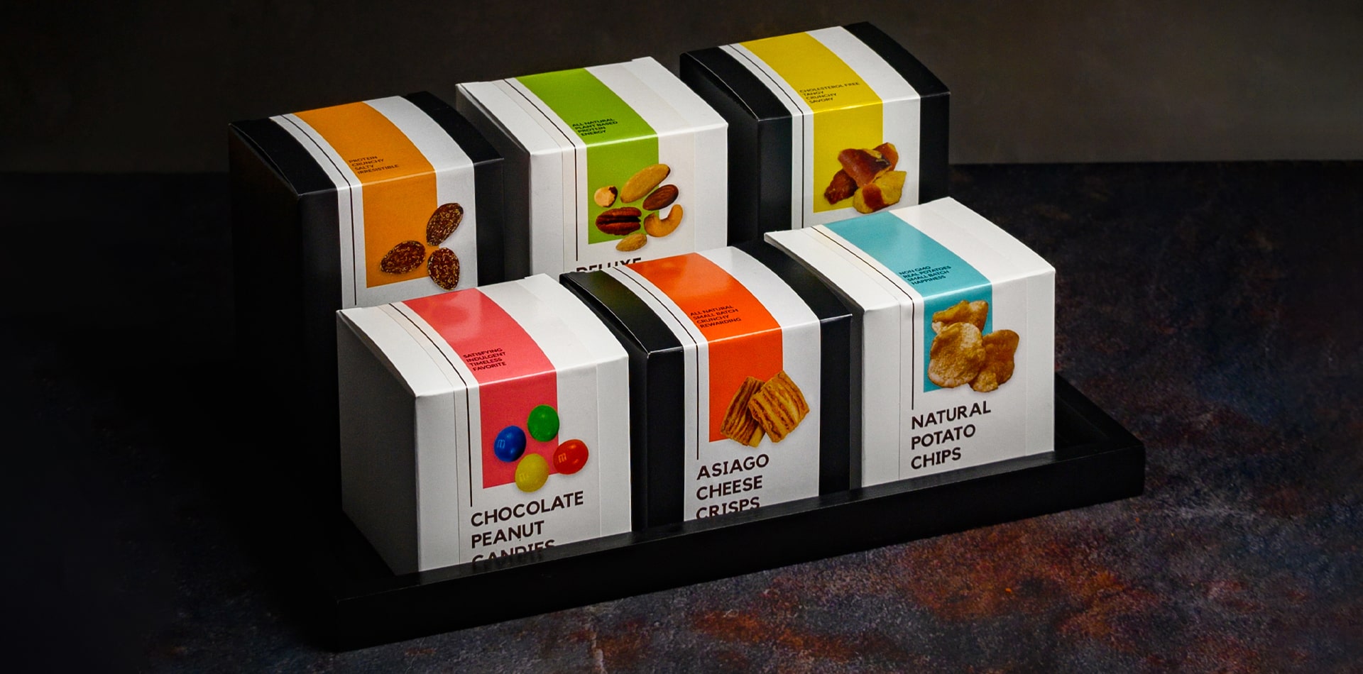 High-quality gourmet treats displayed in a modern hotel minibar.
