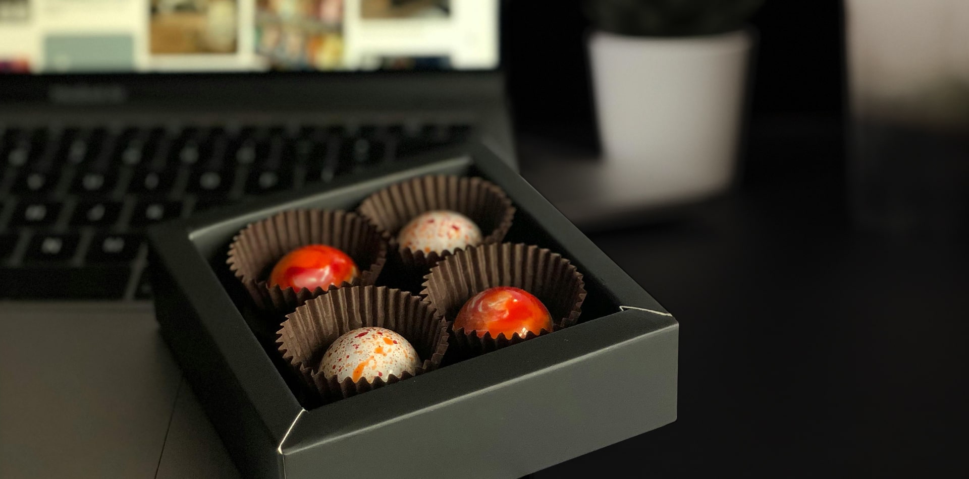 Employee receiving a small Torn Ranch gourmet gift box, representing the impact of under-$10 appreciation gifts.